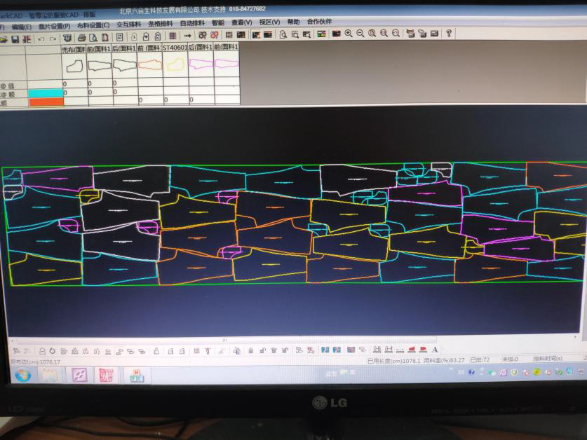 Nested garment pattern marker displayed on a CAD monitor