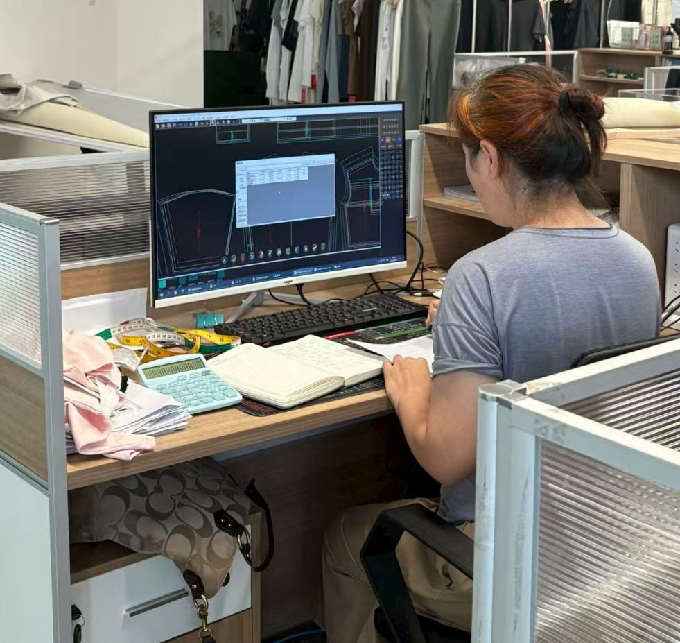 Technician working at a CAD pattern design workstation