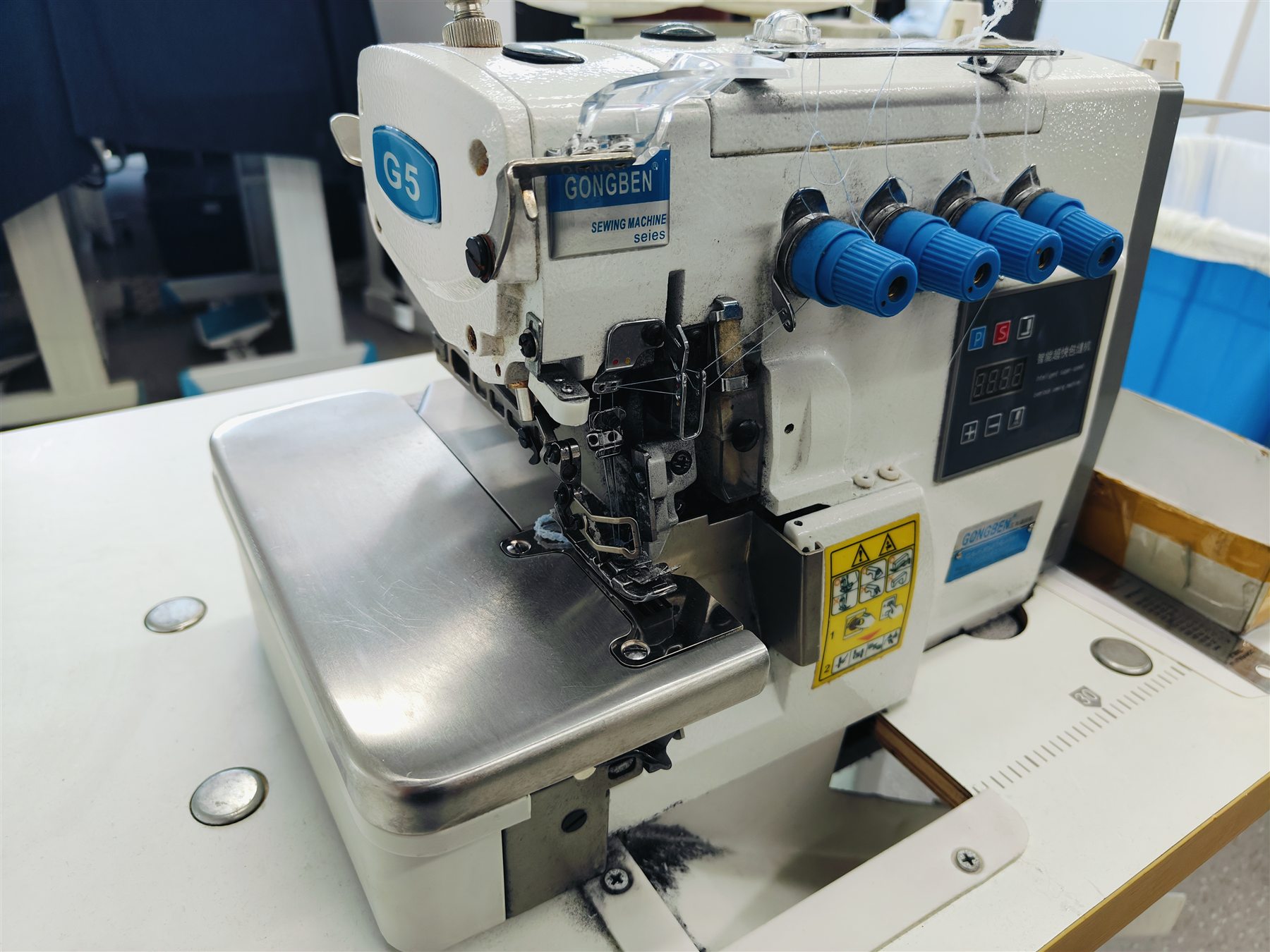 Industrial sewing station prepared for knit garment production