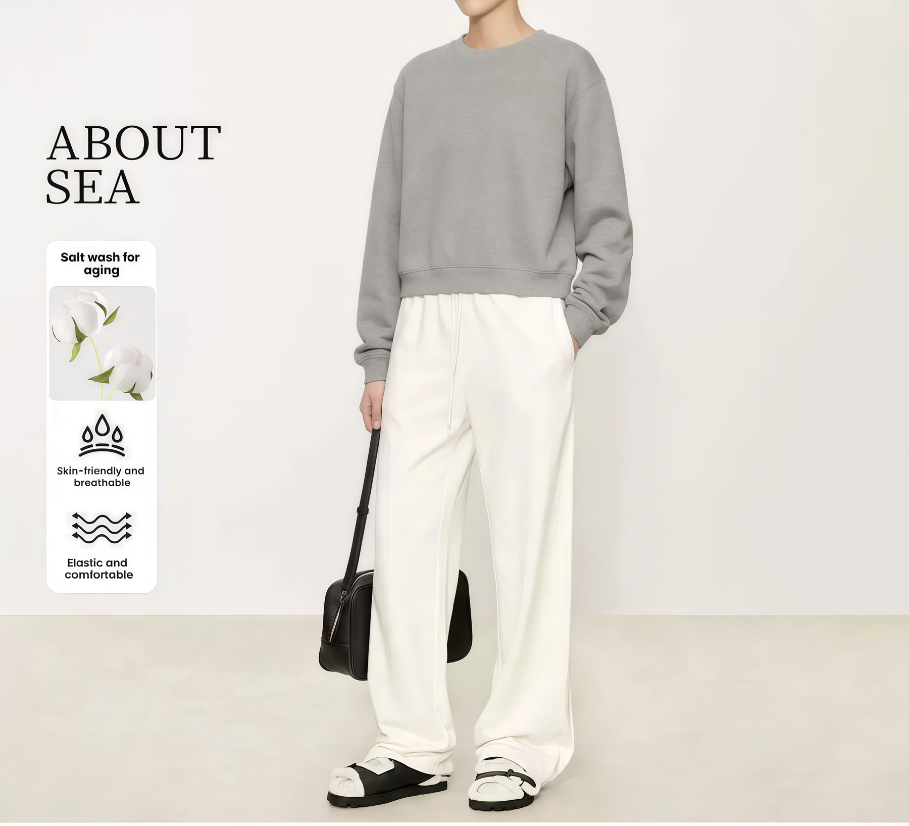 Grey sweatshirt styled with white wide-leg trousers